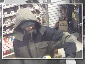Surveillance image of suspect in convenience store robberies in Hamilton.