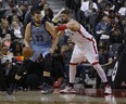 Toronto Raptors Jonas Valanciunas C (17) guards against Memphis Grizzlies Marc Gasol C (33) during the first half  in Toronto, Ont. on Thursday December 1, 2016. Jack Boland/Toronto Sun/Postmedia Network