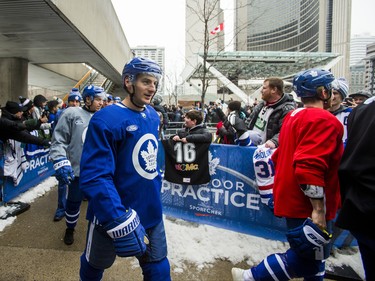 Toronto Maple Leafs make their way past fans for the 2019 Toronto Maple Leafs Outdoor Practice at Nathan Phillips Square in Toronto, Ont. on Thursday February 7, 2019. Ernest Doroszuk/Toronto Sun/Postmedia