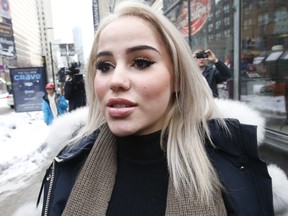 Marcella Zoia, 19, is pictured while leaving Toronto's  College Park courts on Feb. 13, 2019. (Jack Boland, Toronto Sun)