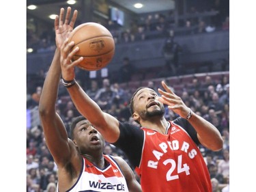 Toronto Raptors forward Norman Powell (24) and Washington Wizards center Thomas Bryant (13) on Wednesday February 13, 2019. The Toronto Raptors host the Washington Wizards at the Scotiabank Arena in Toronto. Veronica Henri/Toronto Sun/Postmedia Network