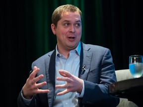 Conservative Leader Andrew Scheer responds to a question during a Surrey Board of Trade event, in Surrey, B.C., on Feb. 1, 2019. The Conservatives say they'll take all the Heritage Minute branding off a web advertisement they released on the weekend.