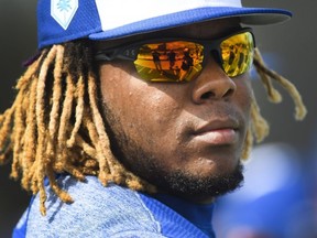 Blue Jays infielder Vladimir Guerrero Jr. looks on at practice during spring training in Dunedin, Fla., on Feb. 18, 2019.