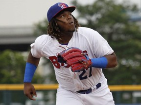 Buffalo Bisons' Vladimir Guerrero Jr. chases a foul ball hit by a Lehigh Valley IronPigs batter during his Triple-A debut with the affiliate of the Toronto Blue Jays on July 31, 2018, in Buffalo, N.Y.