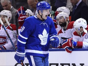 Maple Leafs left wing Zach Hyman celebrates his goal in the third period as the Canadiens' bench looks on during NHL action in Toronto on Saturday, Feb. 23, 2019.