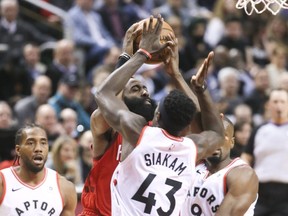 Raptors forward Pascal Siakam defends against Houston Rockets guard James Harden during Tuesday's game. (VERONICA HENRI/Toronto Sun)