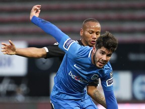 Genk’s Alejandro Pozuelo and Charleroi’s Marco Ilaimaharitra fight for the ball during their game last week. (GETTY IMAGES)
