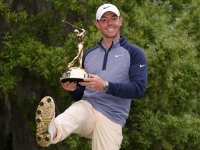 PONTE VEDRA BEACH, FLORIDA - MARCH 17:  Rory McIlroy of Northern Ireland shows how the sole of his shoes matches the winner's trophy after winning The PLAYERS Championship on The Stadium Course at TPC Sawgrass on March 17, 2019 in Ponte Vedra Beach, Florida. (Photo by Richard Heathcote/Getty Images)
