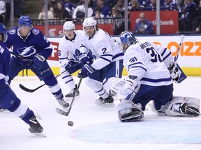 Maple Leafs goaltender Frederik Andersen keeps an eye on the puck before it's shot in by Tampa Bay Lightning centre Tyler Johnson during Monday's game. (THE CANADIAN PRESS)