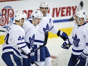 Toronto Maple Leafs' Zach Hyman (right) celebrates his goal with teammates (left to right) Morgan Rielly, Mitch Marner and John Tavares last week. (THE CANADIAN PRESS)