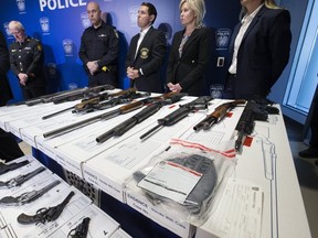Peel Regional Police provided an overview on Project Baron which resulted in the seizure of a large number of guns, cash and hard drugs. Mississauga Mayor Bonnie Crombie (second from right), and her Brampton counterpart, Patrick Brown (to her right) were present for the press conference. (Stan Behal, Toronto Sun)