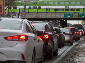 A GO train above vehicles lining up on Jarvis St. while waiting to get on the Gardiner Expressway on Jan. 22, 2019. (Ernest Doroszuk,Toronto Sun)