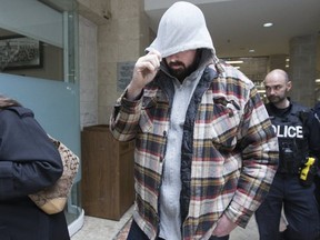 Victoria Small and her son, Jason, leave a Newmarket court after pleading guilty to permitting animals to be in distress (Stan Behal, Toronto Sun)