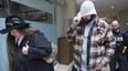 Victoria Small and her son, Jason, leave a Newmarket court after pleading guilty to permitting animals to be in distress (Stan Behal, Toronto Sun)