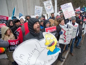 Teachers shout slogans earlier this month as nearly 300 teachers, parents of autistic children, unionists and a variety of supporters gathered outside a sports centre in suburban Ottawa where Premier Doug Ford was attending a spaghetti supper and fundraiser. (Wayne Cuddington. Postmedia)