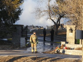 A mansion in rural Pickering was reduced to rubble by an explosion and fire. The fire-ravaged structure is pictured on March 25 -- the day of the mishap. (JACK BOLAND, Toronto Sun)