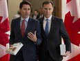 Prime Minister Justin Trudeau and then Finance Minister Bill Morneau speak as they walk to the House of Commons in Ottawa, Tuesday March 19, 2019. THE CANADIAN PRESS