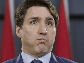 Prime Minister Justin Trudeau grimaces as he holds a news conference in Ottawa on March 7, 2019. (The Canadian Press)