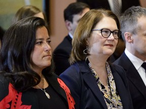 Liberal MPs Jody Wilson-Raybould (left) and Jane Philpott take part in a cabinet shuffle at Rideau Hall in Ottawa on Jan. 14, 2019.