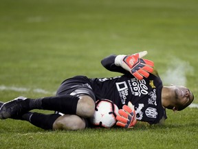 Club Atletico Independiente goalkeeper Jose Guerra lays on the pitch during last month's game against TFC at BMO Field. (THE CANADIAN PRESS)