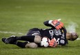 Club Atletico Independiente goalkeeper Jose Guerra lays on the pitch during last month's game against TFC at BMO Field. (THE CANADIAN PRESS)