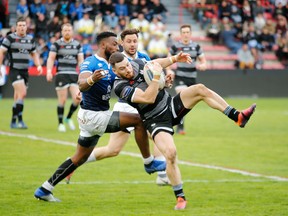 Toronto's Blake Wallace carries the ball in the Wolfpack's game last week against Toulouse. (THE CANADIAN PRESS)