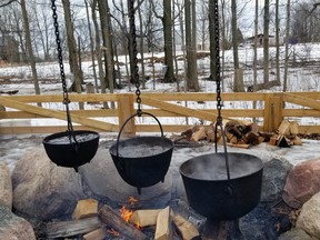 The three-kettle method for making maple syrup is displayed at the Bronte Creek festival. (IAN SHANTZ/THE TORONTO SUN)