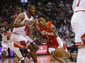 Toronto Raptors' Patrick McCaw drives to the net past Chicago Bulls' Cristiano Felicio during Tuesday's game. (JACK BOLAND/Toronto Sun)