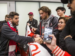 New TFC midfielder Alejandro Pozuelo greets waiting fans as he arrives at Pearson International Airport last week. (ERNEST DOROSZUK/Toronto Sun)