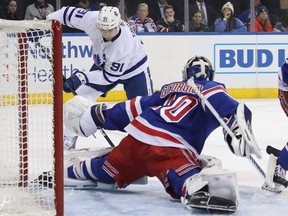 Rangers goaltender Alexandar Georgiev makes a save on Maple Leafs forward John Tavares during first period NHL action at Madison Square Garden in New York City on Feb. 10, 2019.