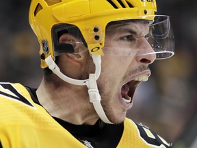 Pittsburgh Penguins' Sidney Crosby celebrates his second goal of the second period during an NHL hockey game against the Washington Capitals in Pittsburgh, Tuesday, March 12, 2019.