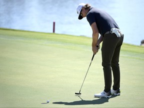 Roger Sloan, of Canada, makes a putt on the 18th green during the first round of the Arnold Palmer Invitational golf tournament at Bay Hill, Thursday, March 7, 2019, in Orlando, Fla. (AP Photo/Phelan M. Ebenhack)