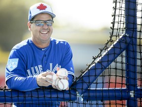 Toronto Blue Jays manager Charlie Montoyo gets ready to throw a batting practice session during baseball spring training in Dunedin, Fla., on Sunday, February 17, 2019. THE CANADIAN PRESS/Nathan Denette