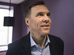 Federal Finance Minister Bill Morneau arrives for a pre-budget photo opportunity at the Kiwanis Boys and Girls Club in Toronto on Thursday, March 14, 2019.