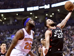 New York Knicks centre Mitchell Robinson (26) looks on as Toronto Raptors guard Fred VanVleet (23) drives to the net during first half NBA basketball action in Toronto, Monday, March 18, 2019. THE CANADIAN PRESS