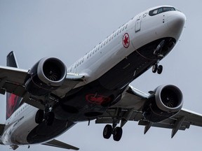 An Air Canada Boeing 737 Max aircraft arriving from Toronto prepares to land at Vancouver International Airport in Richmond, B.C., on Tuesday, March 12, 2019.