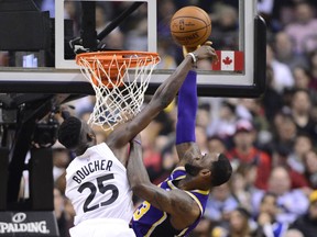 Raptors forward Chris Boucher (left) blocks a shot from Los Angeles Lakers forward LeBron James during a game on March 14. Boucher  is expected to be in the 905 lineup on Tuesday. (Frank Gunn/The Canadian Press)