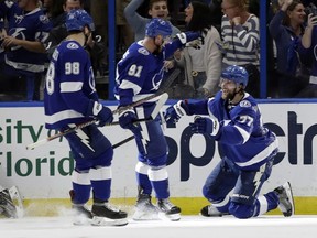 Tampa Bay Lightning defenseman Victor Hedman celelbrates his goal against the Boston Bruins with center Steven Stamkos and defenseman Mikhail Sergachev during the third period of an NHL hockey game Monday, March 25, 2019, in Tampa, Fla.
