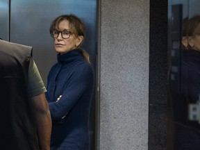 Desperate indeed! Felicity Huffman looks more like a common criminal at a Boston courthouse after being charged in a massive exam cheating scandal.