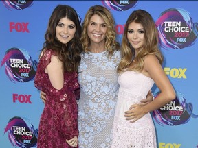 Lori Loughlin, centre, and her daughters Bella, left, and Olivia Jade, right. She and her hubby allegedly paid $500,000 in bribes to get the party girls into good schools as bogus rowers. GETTY IMAGES