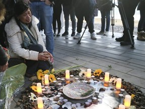 A candlelight vigil was held for Danielle Moore at Inukshuk Park on Thursday, March 14, 2019. Her mother Clariss Moore, left, breaks down and is comforted by others.