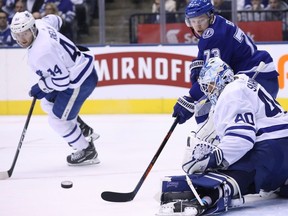 Toronto Maple Leafs goaltender Garret Sparks (40) makes a stop on Tampa Bay Lightning left wing Adam Erne (73) as defenceman Morgan Rielly (44) looks on during second period NHL hockey action in Toronto on Monday, March 11, 2019. THE CANADIAN PRESS/Cole Burston