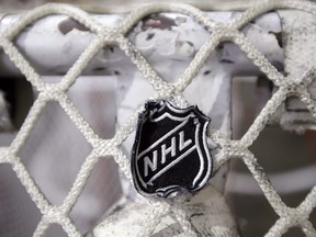 The NHL logo is seen on a goal at a Nashville Predators practice rink in Nashville, Tenn on Sept. 17, 2012. THE CANADIAN PRESS/ AP/Mark Humphrey