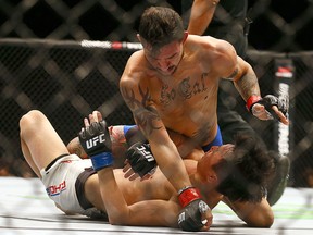 Cub Swanson rains down punches on Doo Ho Choi during the main card of UFC 206 at the Air Canada Centre in Toronto on Saturday, December 10, 2016. (Dave Abel/Toronto Sun)