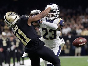 In this Jan. 20, 2019, file photo, Los Angeles Rams' Nickell Robey-Coleman breaks up a pass intended for New Orleans Saints' Tommylee Lewis during the second half of the NFL football NFC championship game in New Orleans. (AP Photo/Gerald Herbert, File)