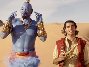Will Smith (left) stars as the Genie, with Mena Massoud as Aladdin, in Disney's live-action reboot of "Aladdin."