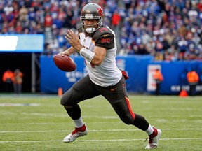 In this Nov. 18, 2018, file photo, Tampa Bay Buccaneers quarterback Ryan Fitzpatrick rushes for a touchdown against the New York Giants during an NFL football game in East Rutherford, N.J.