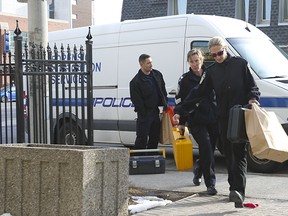 Peel Region Police Forensic officers show up to 20 Ann St. building located just west of Hwy. 10 and Lakeshore Rd. W. A 54-year old man was allegedly stabbed to death by his 48 -year female partner. Police have charged Mary Ljubanovich with second-degree murder on Saturday March 9, 2019. Jack Boland/Toronto Sun/Postmedia Network