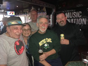Timothy Brem (centre) and other at Timothy’s Pub on March 19, 2019. (Joe Warmington, Toronto Sun)