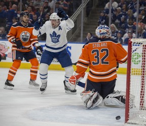 Oilers goalie Anthony Stolarz looks behind him as John Tavares of the Maple Leafs celebrates a goall in the first period at Rogers Place in Edmonton on March 9, 2018. (Shaughn Butts / Postmedia)